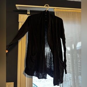 Hard to take a photo but it’s a basic grey cardigan in excellent condition